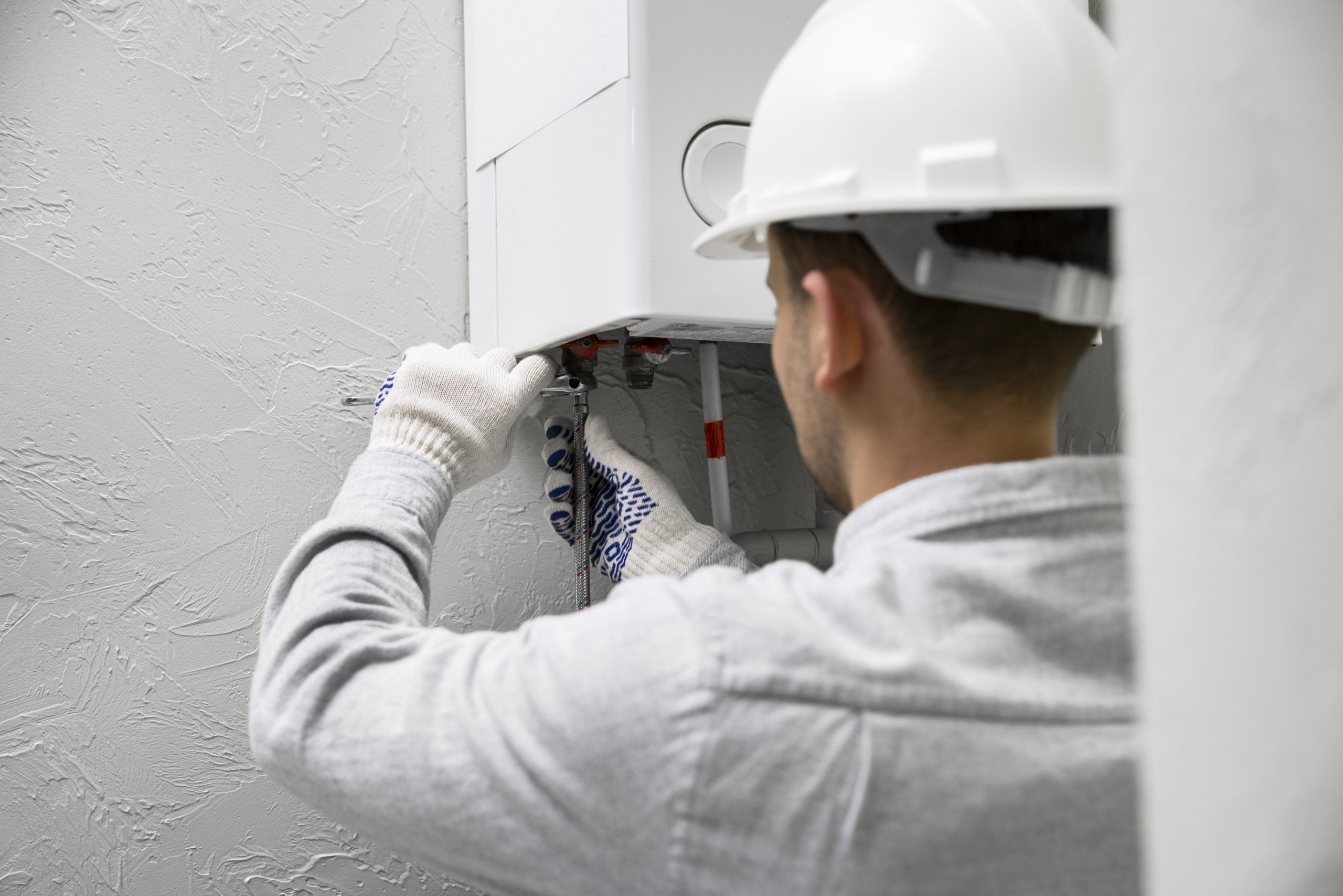 Engineer repairing boiler